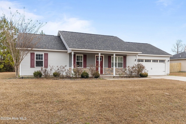 ranch-style house with a porch, a garage, and a front lawn