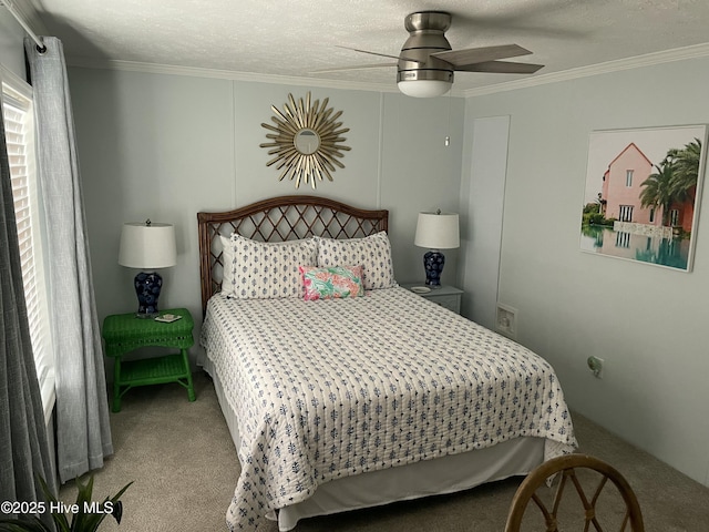 bedroom with carpet, a textured ceiling, ceiling fan, and ornamental molding