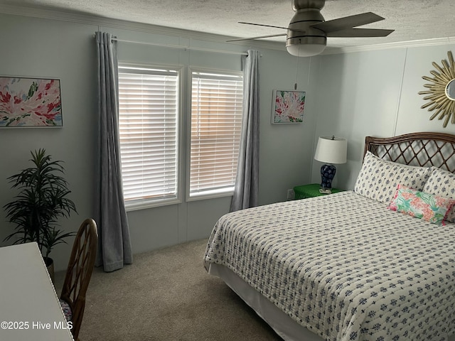 bedroom with ceiling fan, light colored carpet, a textured ceiling, and multiple windows