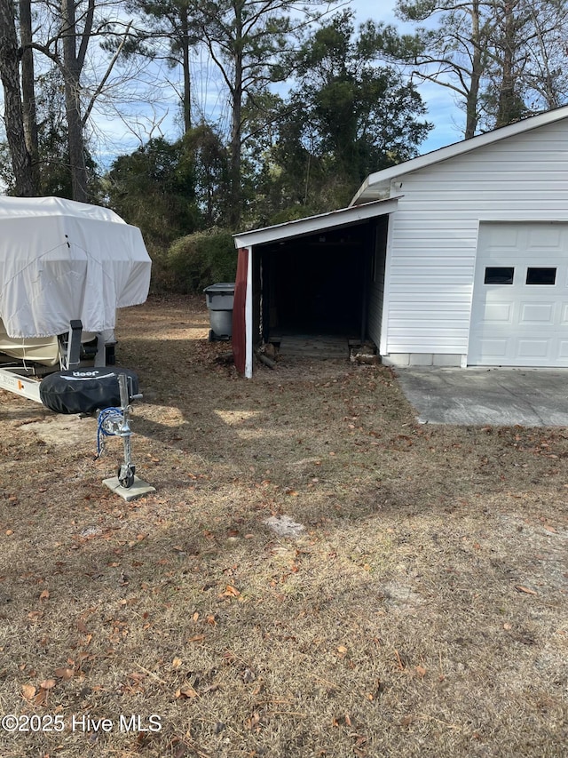 view of yard featuring a garage