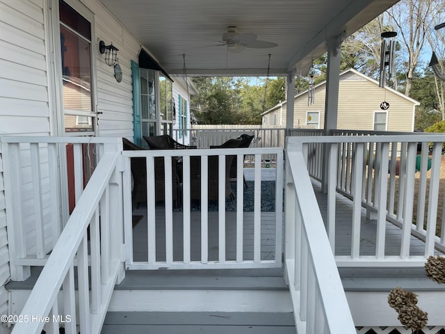 deck featuring ceiling fan and a porch