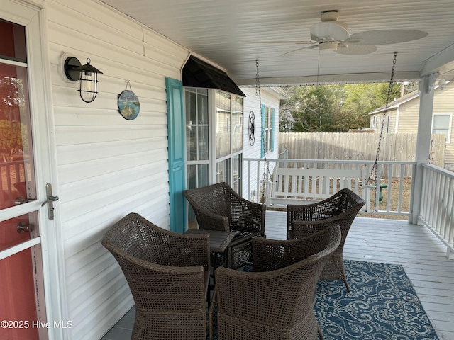 exterior space with ceiling fan and a porch