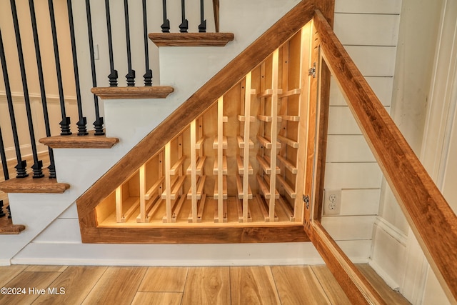 stairway featuring wood finished floors