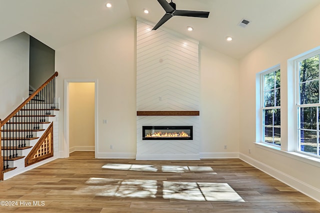 3375 Sandridge Ln SW, Supply, NC 28462 - unfurnished living room with a ceiling fan, baseboards, high vaulted ceiling, and stairs