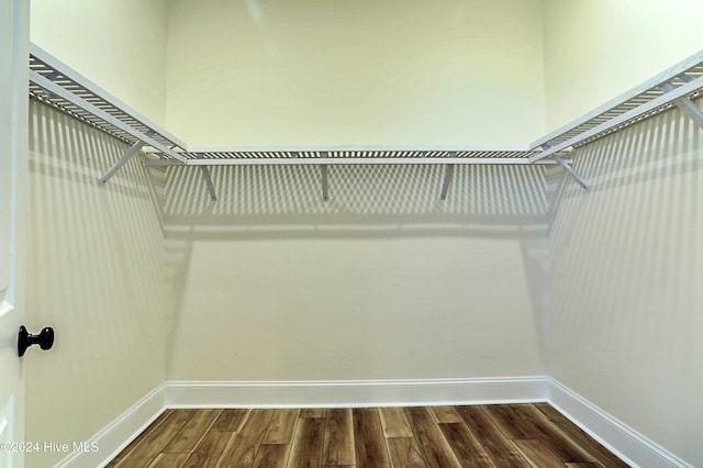 3375 Sandridge Ln SW, Supply, NC 28462 - walk in closet with dark wood-style floors