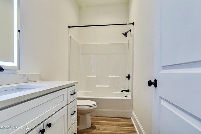 spare room with ceiling fan and light wood-type flooring