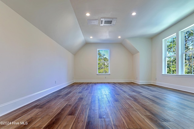 additional living space with lofted ceiling, dark wood-style flooring, baseboards, and recessed lighting