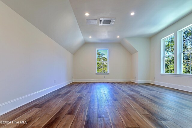 3375 Sandridge Ln SW, Supply, NC 28462 - bonus room with baseboards, lofted ceiling, a healthy amount of sunlight, and dark wood-style floors