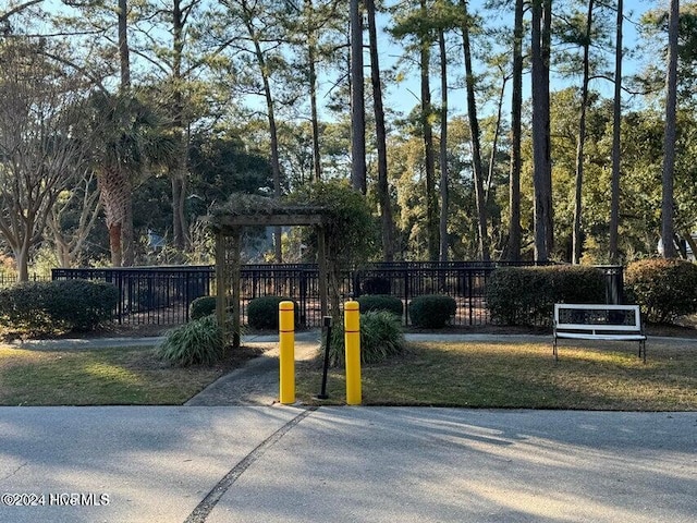 view of jungle gym featuring fence