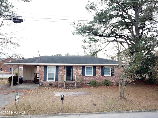 ranch-style house with a carport