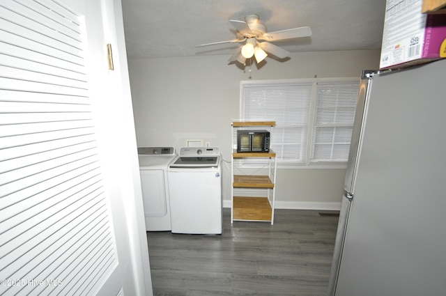 laundry room featuring dark hardwood / wood-style flooring, ceiling fan, and washer and clothes dryer