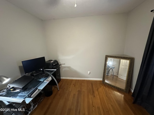 office with hardwood / wood-style flooring