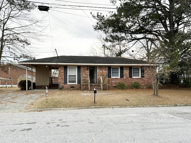 ranch-style home featuring a carport