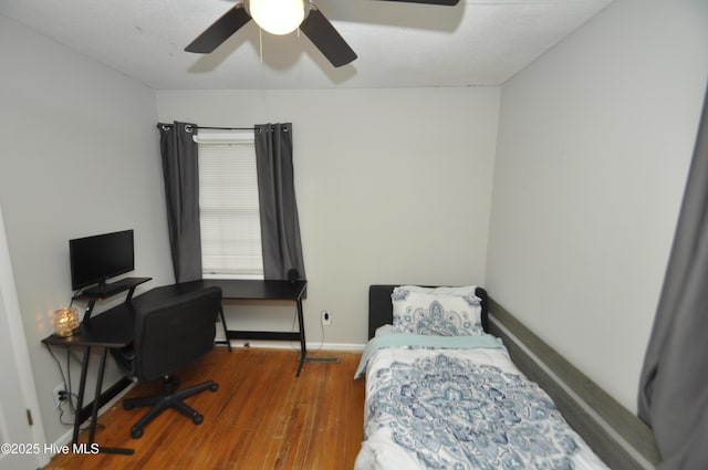 bedroom featuring hardwood / wood-style floors and ceiling fan