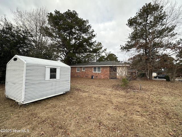 view of outbuilding featuring a lawn