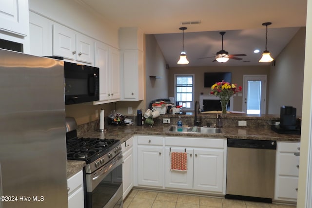 kitchen featuring white cabinets, pendant lighting, sink, and stainless steel appliances