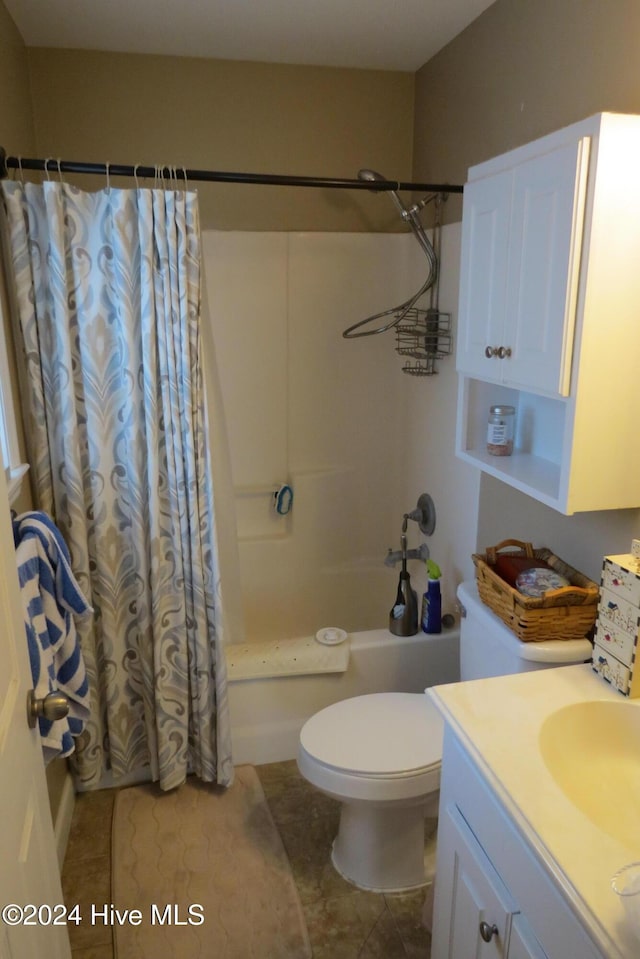 full bathroom with shower / bath combo with shower curtain, tile patterned flooring, vanity, and toilet