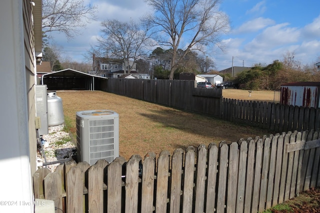 view of yard with central air condition unit