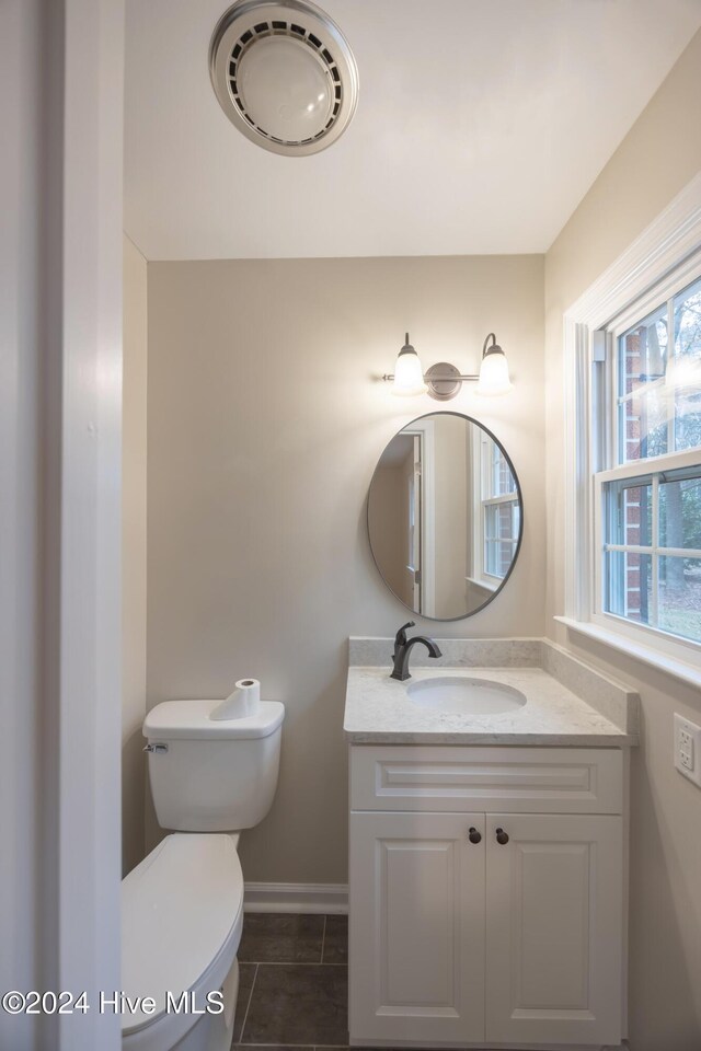 unfurnished bedroom featuring a textured ceiling, light hardwood / wood-style floors, and a closet