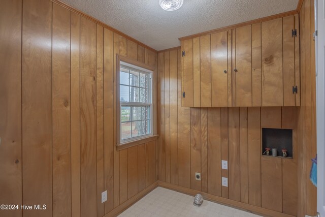 unfurnished bedroom with a closet, light hardwood / wood-style flooring, and a textured ceiling