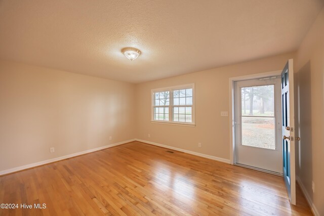 exterior space featuring a yard and central AC