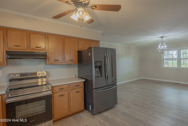 kitchen featuring ceiling fan, sink, light hardwood / wood-style flooring, appliances with stainless steel finishes, and ornamental molding