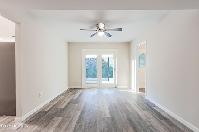 unfurnished room featuring hardwood / wood-style floors and ceiling fan