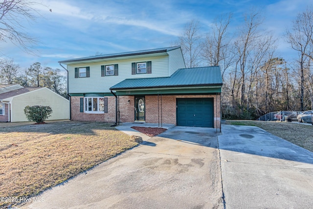 view of front property with a garage and a front lawn