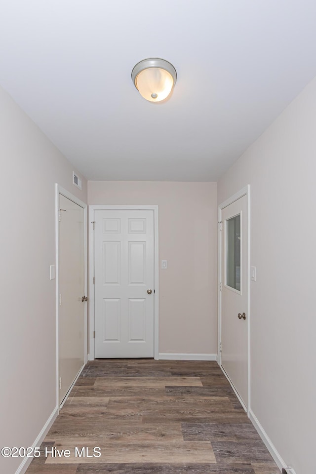 hall featuring dark wood-type flooring