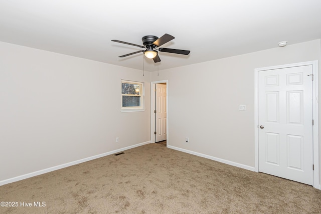 unfurnished room featuring carpet and ceiling fan