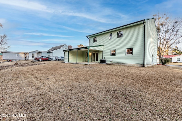 back of house featuring central AC unit and a patio