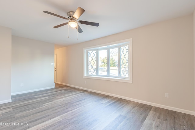 unfurnished room with ceiling fan and light hardwood / wood-style flooring