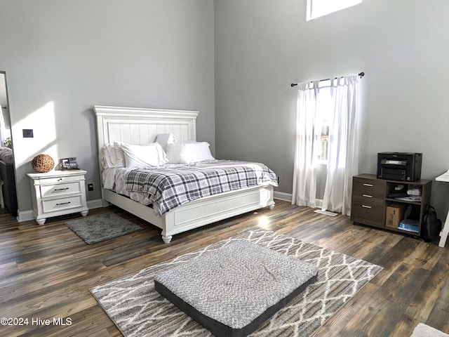 bedroom featuring dark wood-type flooring