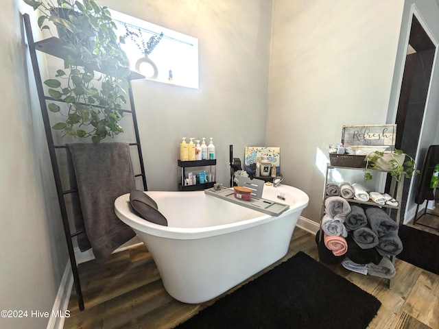 bathroom featuring a tub and wood-type flooring