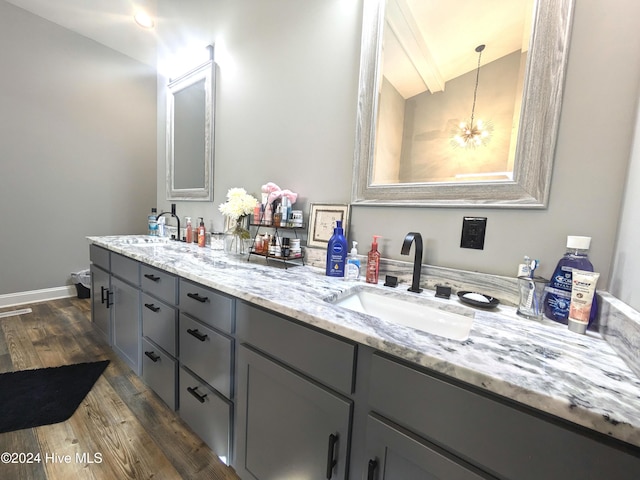 bathroom featuring hardwood / wood-style floors and vanity