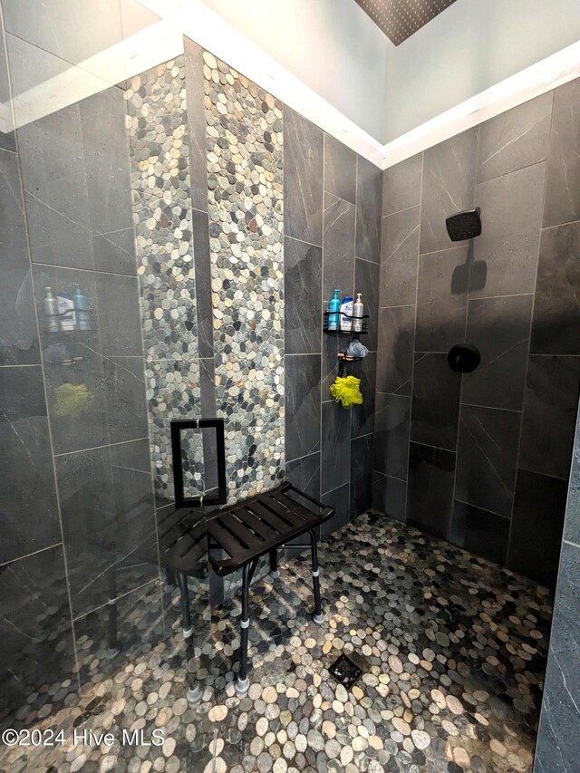 bathroom with a tile shower