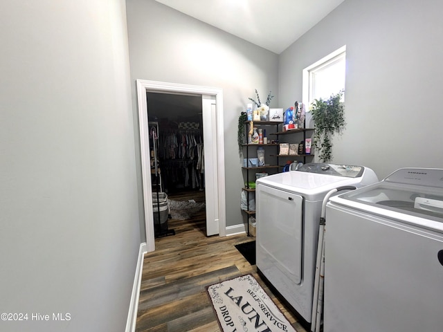 laundry room with washing machine and dryer and dark hardwood / wood-style floors