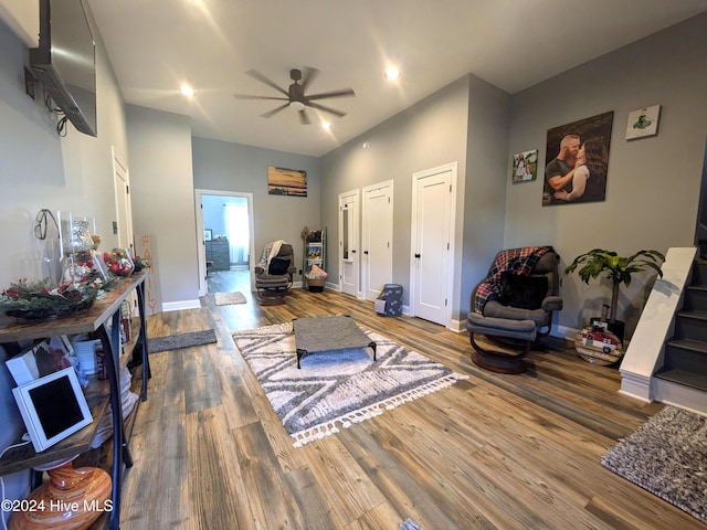 living room featuring ceiling fan and wood-type flooring