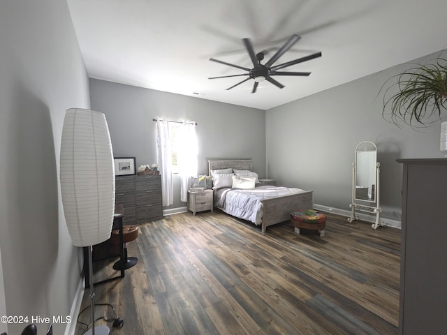 bedroom featuring ceiling fan and dark hardwood / wood-style floors