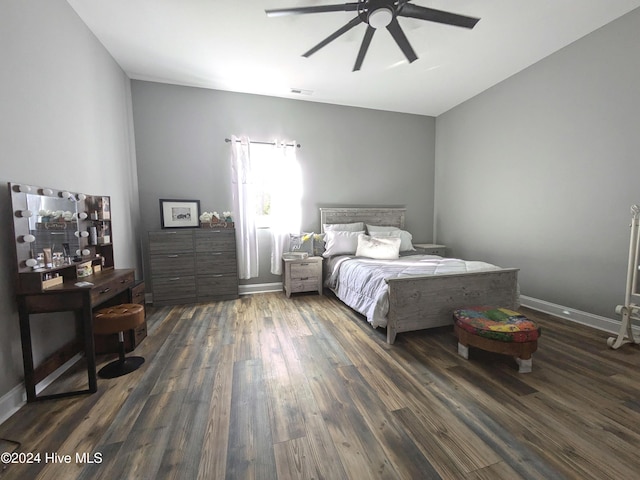 bedroom with ceiling fan and dark hardwood / wood-style floors