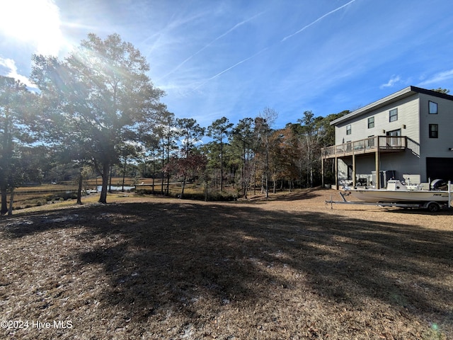 view of yard with a balcony