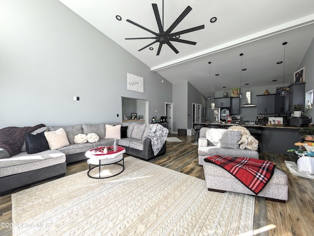 living room featuring beamed ceiling, dark hardwood / wood-style floors, high vaulted ceiling, and ceiling fan