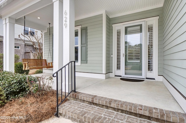 doorway to property featuring a porch