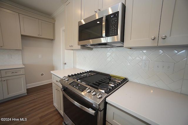 kitchen featuring gray cabinetry, decorative backsplash, and stainless steel appliances