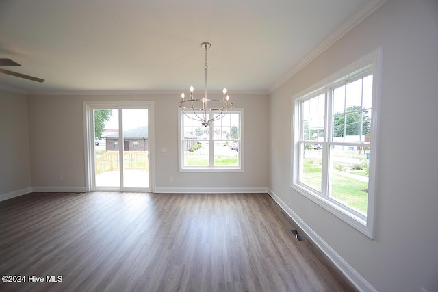 spare room with hardwood / wood-style flooring, ceiling fan with notable chandelier, and crown molding