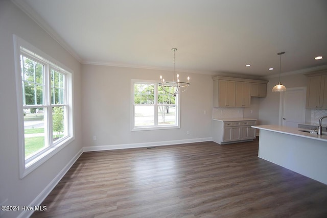 kitchen featuring gray cabinetry, hanging light fixtures, and tasteful backsplash