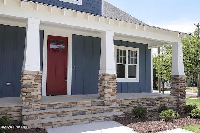 doorway to property featuring a porch