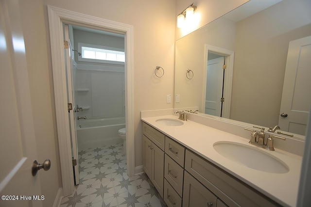 full bathroom with shower / tub combination, vanity, and toilet