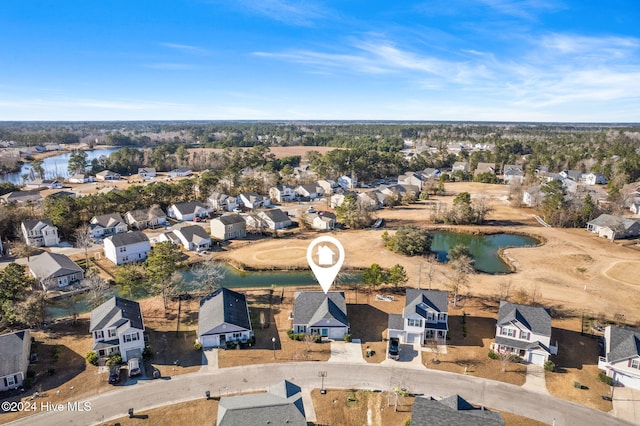 drone / aerial view with a residential view and a water view