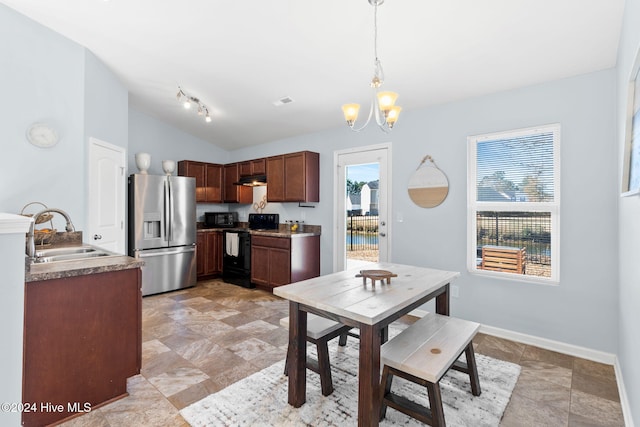 dining area with baseboards, lofted ceiling, and an inviting chandelier